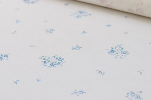 Faded Floral Linen Fabrics with our petite flour on luxury oyster linen in a Lyon blue colour variation