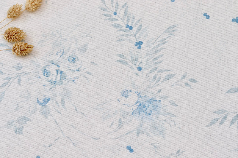 Aimée blue design of small roses with leaves and berries printed on luxury linen - Faded Floral Linen Fabrics - The Faded Floral Company 