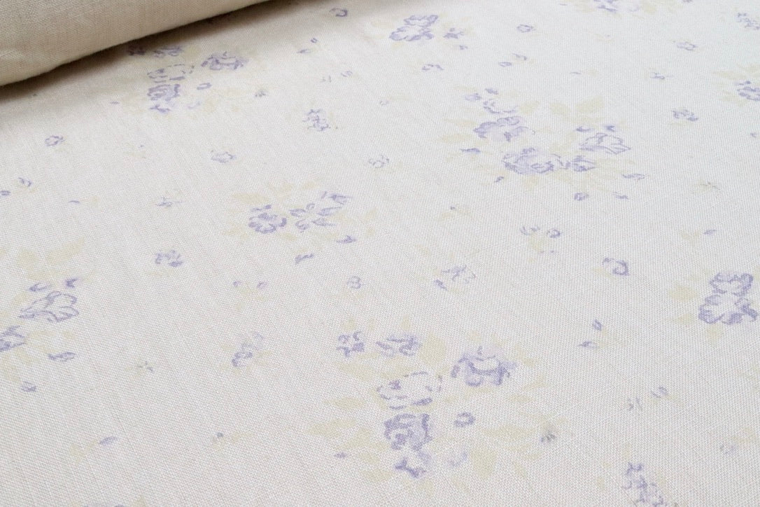 Faded Floral Linen Fabrics with a one-time tumbled linen variation with a lilac colour way of our petite fleur design