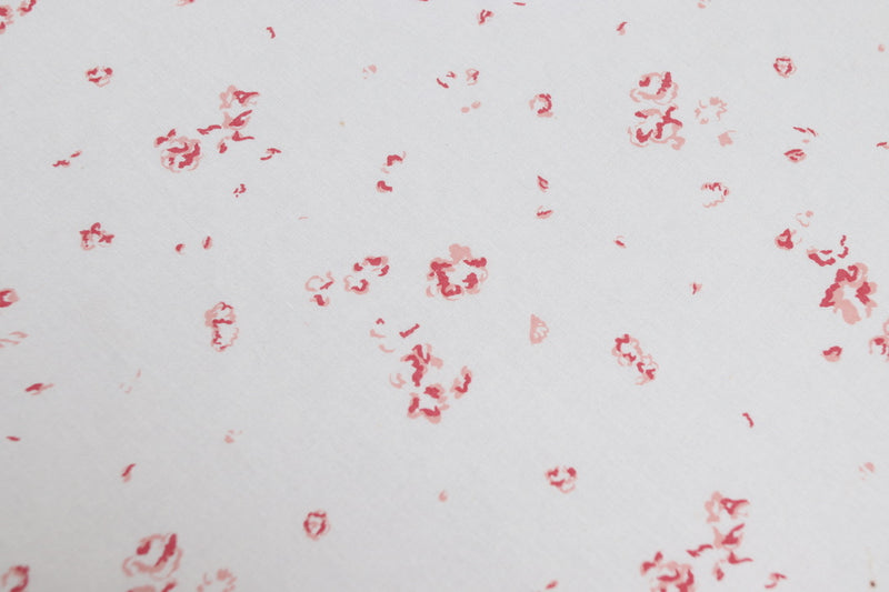 A close up of our delicate Ditsy print in Cerise colour way, printed on luxury cotton - Faded Floral Fabrics 