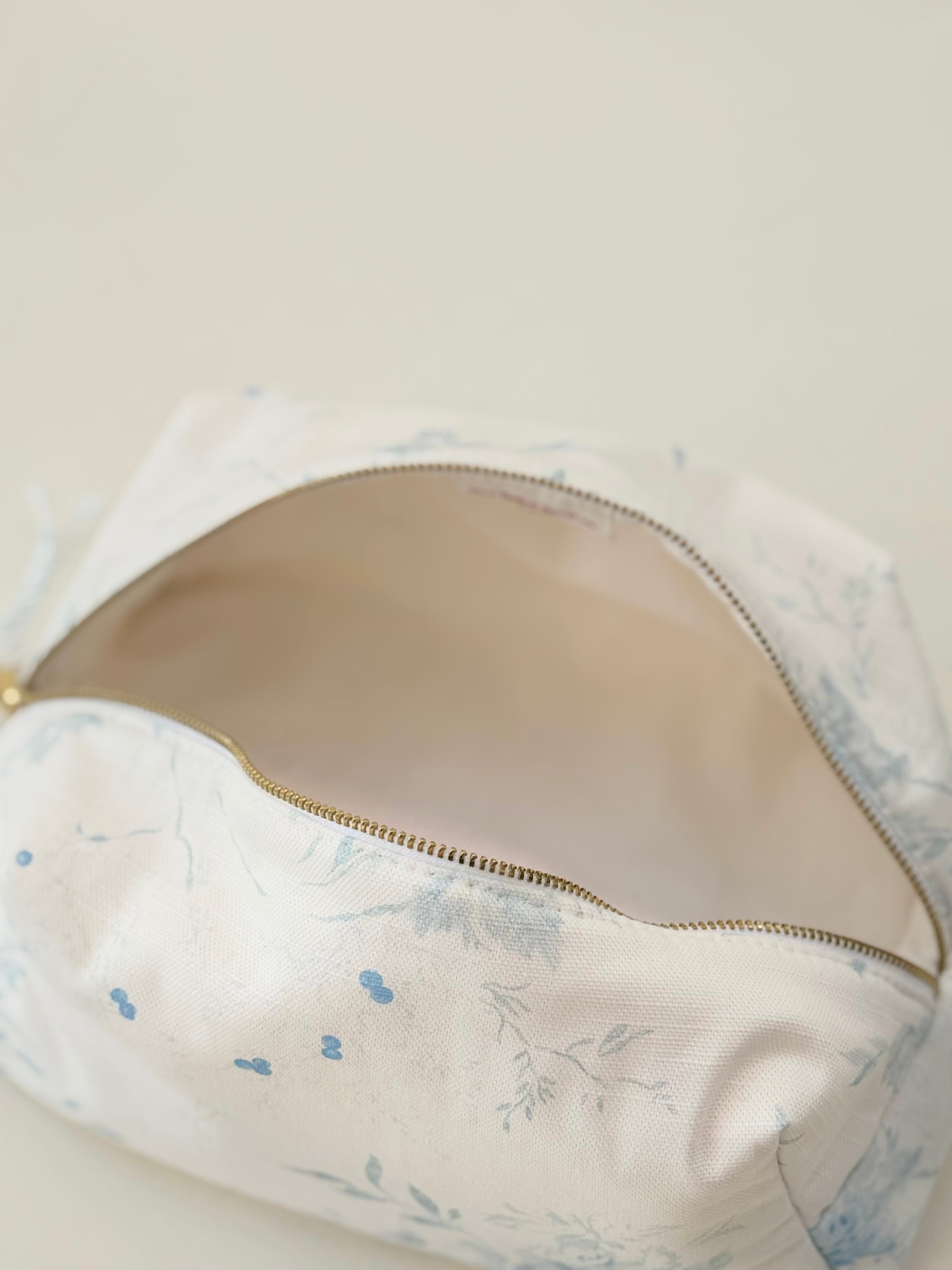 Floral-patterned bra with a zipper on a beige background