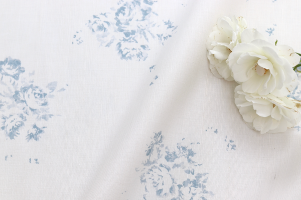 Faded floral linen Fabrics with Camille in Lyon Bleu on Oyster Linen