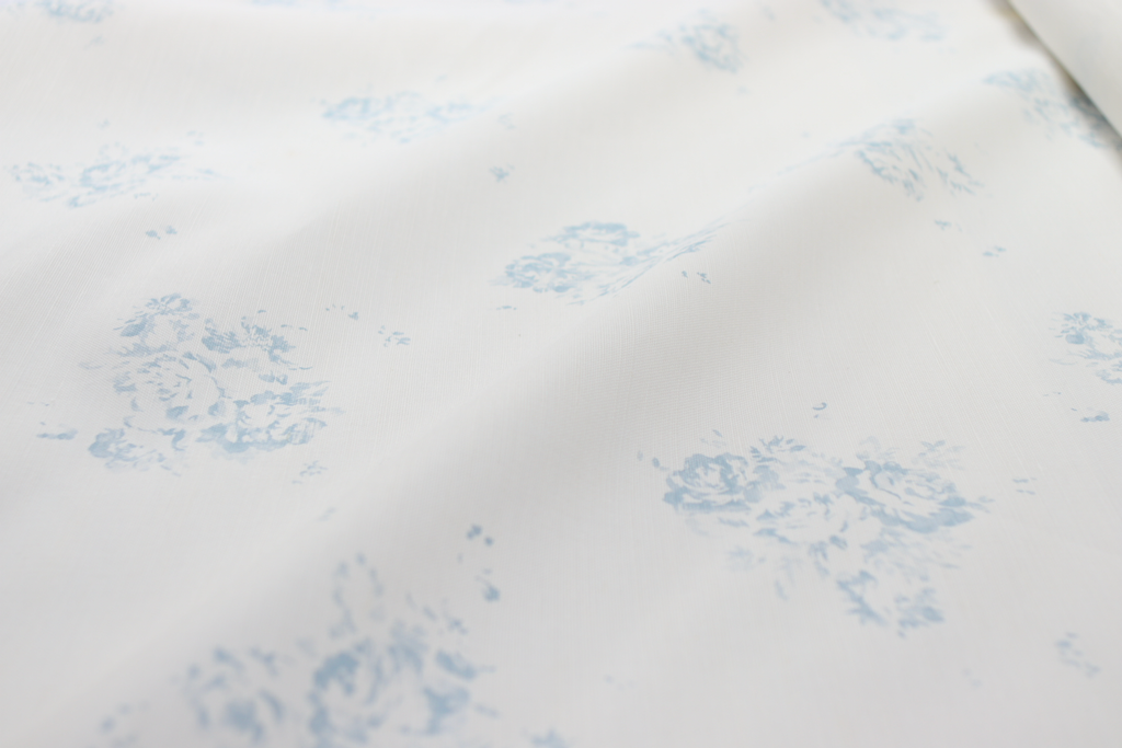 Faded Floral Linen Fabrics with our signature Camille print in our Lyon Bleu, printed on luxury Oyster Linen Fabric