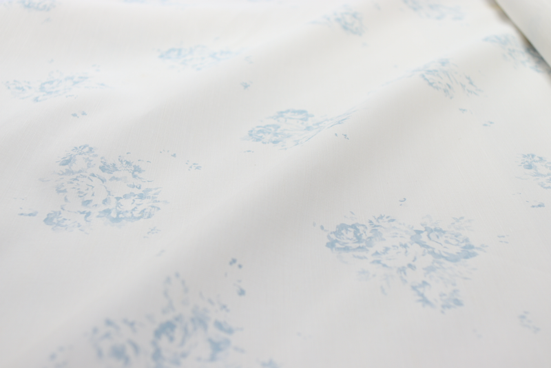 Faded Floral Linen Fabrics with our signature Camille print in our Lyon Bleu, printed on luxury Oyster Linen Fabric