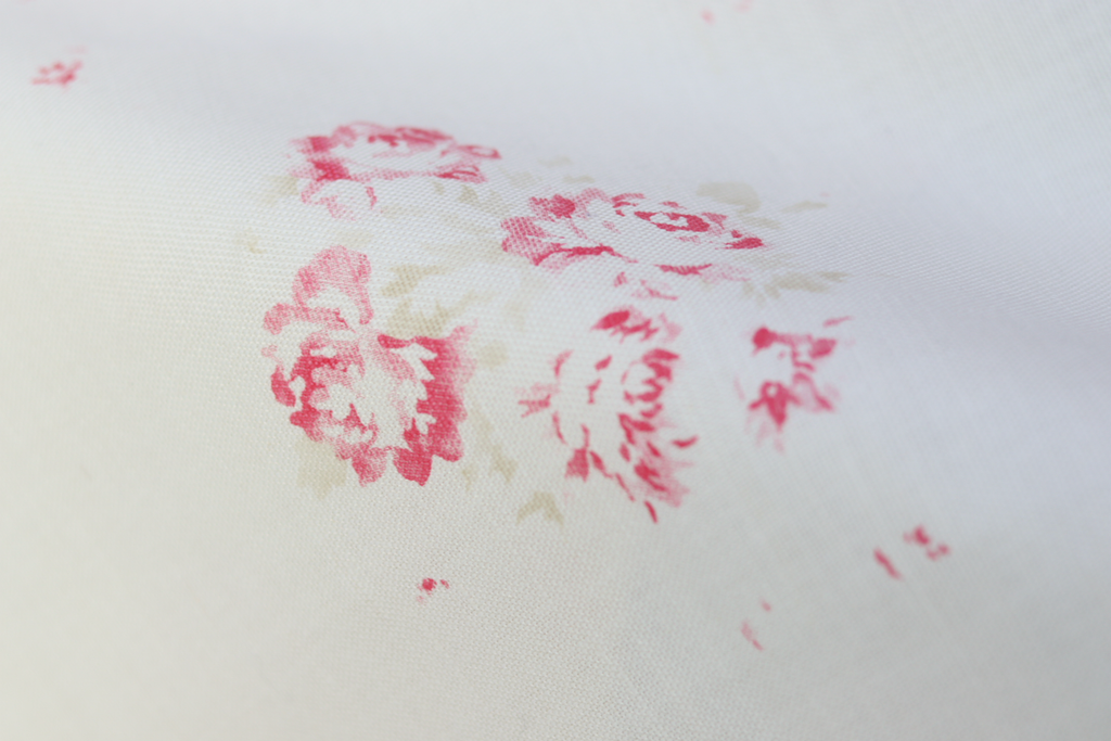 Close-up of our Camille print in Cerise and Fawn on Oyster linen, from our Faded Floral Linen Fabrics collection