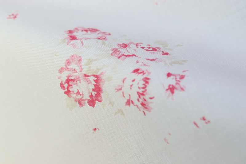 Close-up of our Camille print in Cerise and Fawn on Oyster linen, from our Faded Floral Linen Fabrics collection